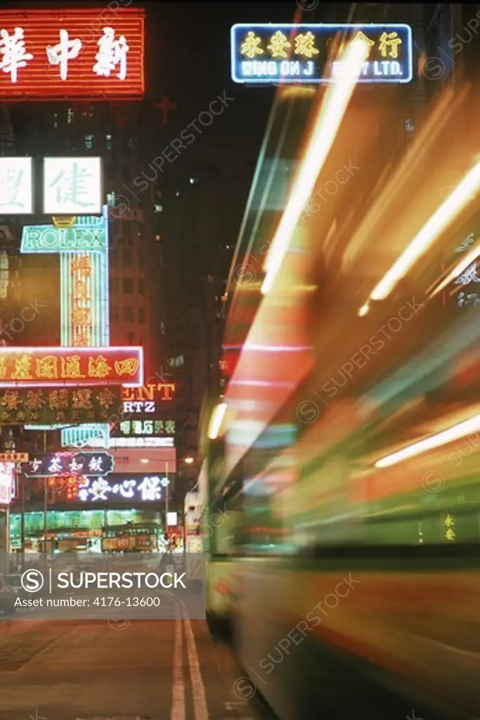 Trams and traffic at night on Hennessy Raod in Causeway Bay Hong Kong