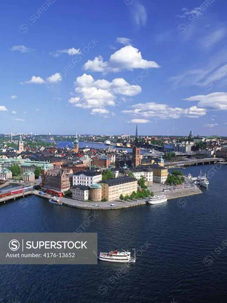 Overview from City Hall of Riddarholmen Island with ferryboat on the Riddarfjarden waters in Stockholm