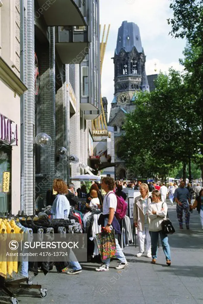 Sidewalk cafes and shoppers near Kaiser Wilhelm Memorial Church in Berlin