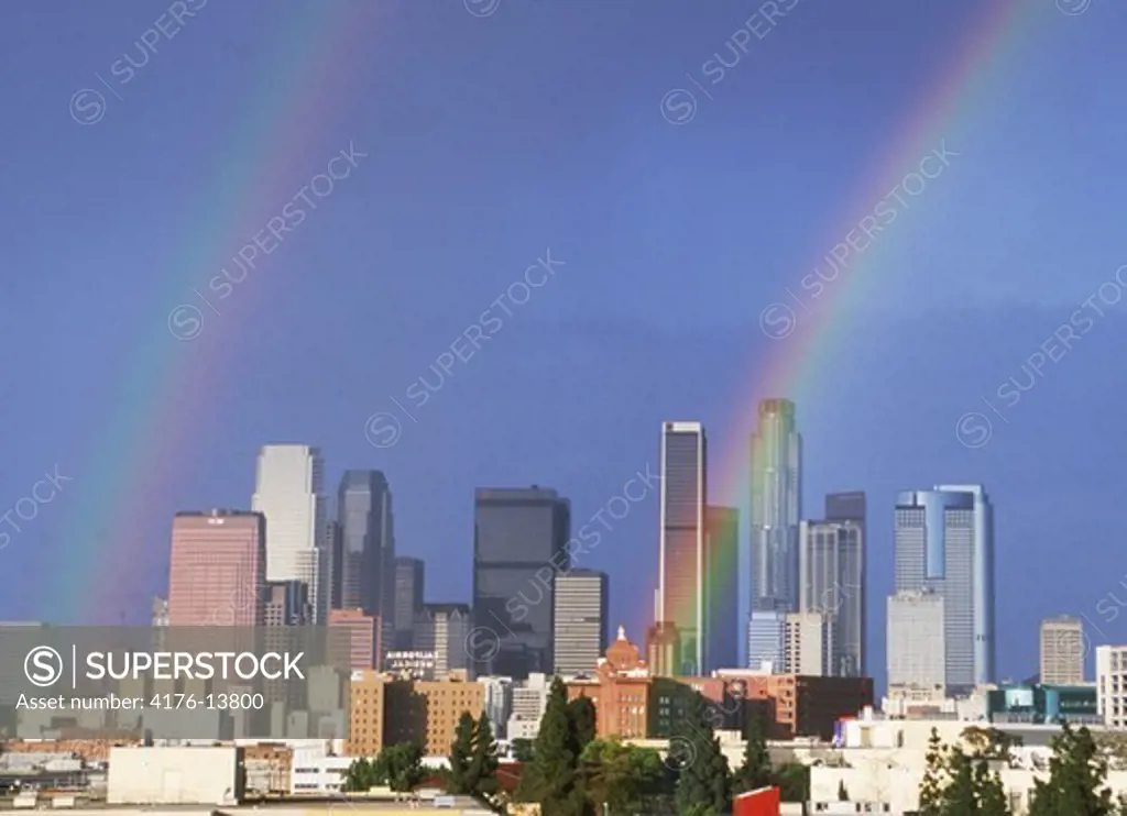 Double rainbow rising out of the skyscrapers in downtown Los Angeles