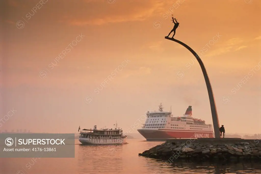 Viking Line passenger ferryboat to Finland passing Nackastrand and Carl Milles statue near Stockholm at sunrise