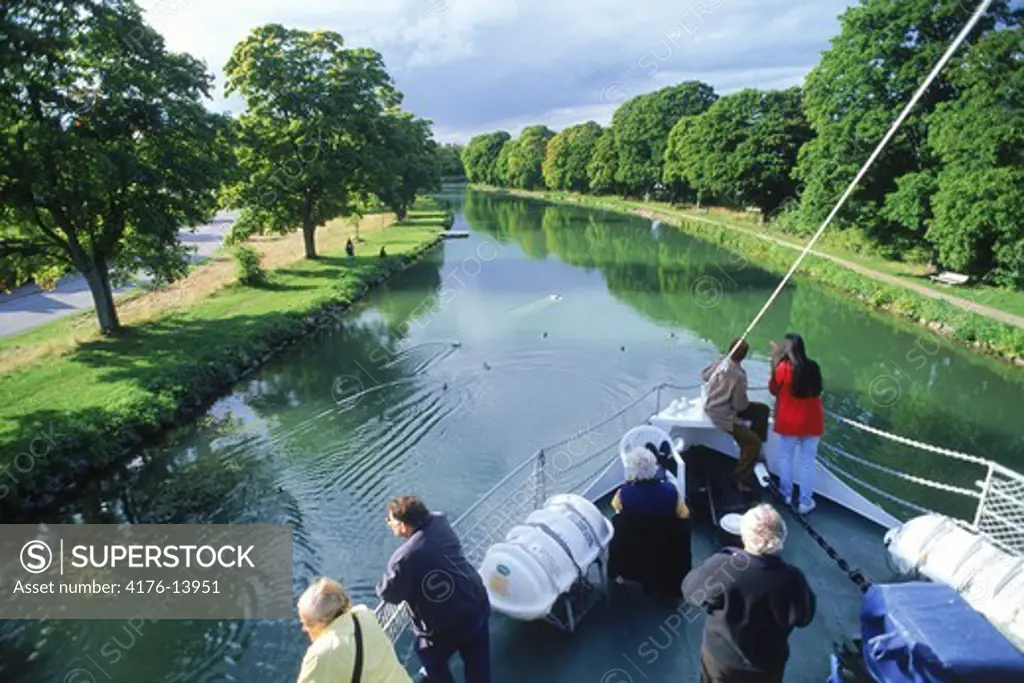 Tourists traveling across Sweden by luxery passenger boat on the Gota Canal between Stockholm and Gothenburg