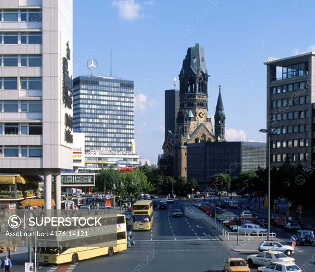 Traffic on Ku-damm Strasse with Kaiser Wilhelm Memorial Church in Berlin Germany
