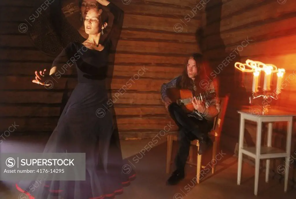Female flamenco dancer with male guitarist