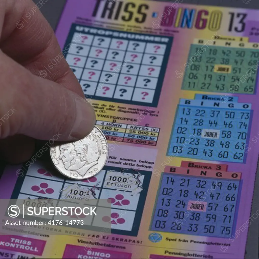 A person scratching lottery ticket