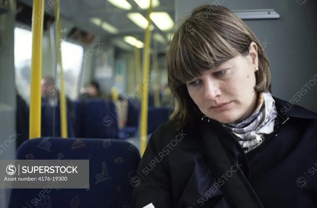 A woman sitting in the train