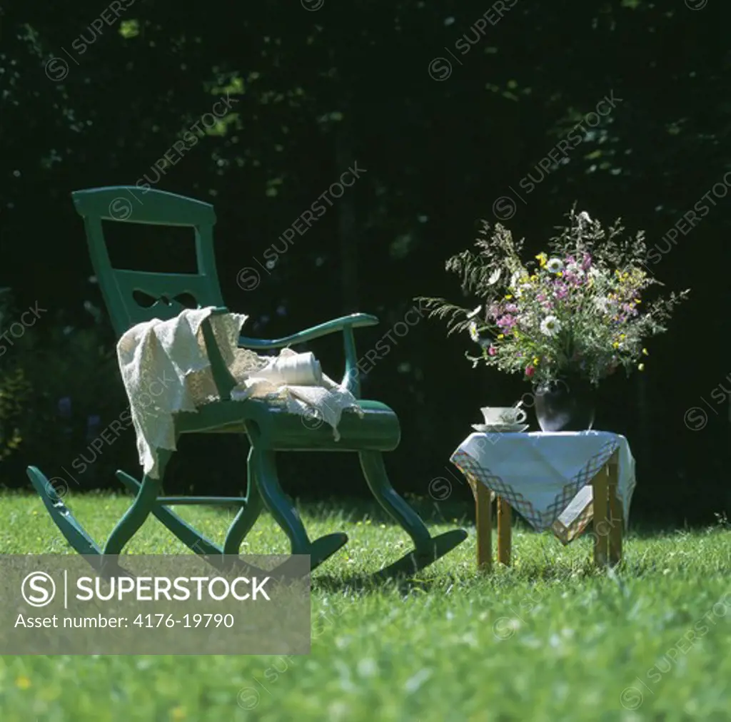 Lawn with rocking chair and table