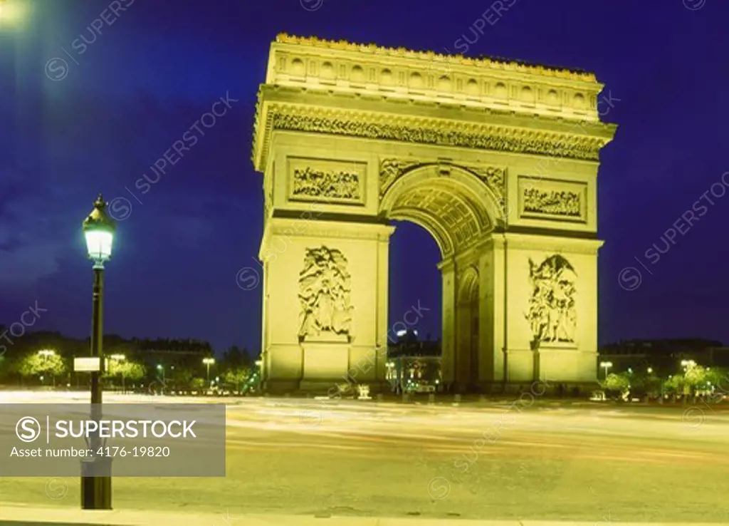 Monument lit up at night, Arc De Triomphe, Paris, France