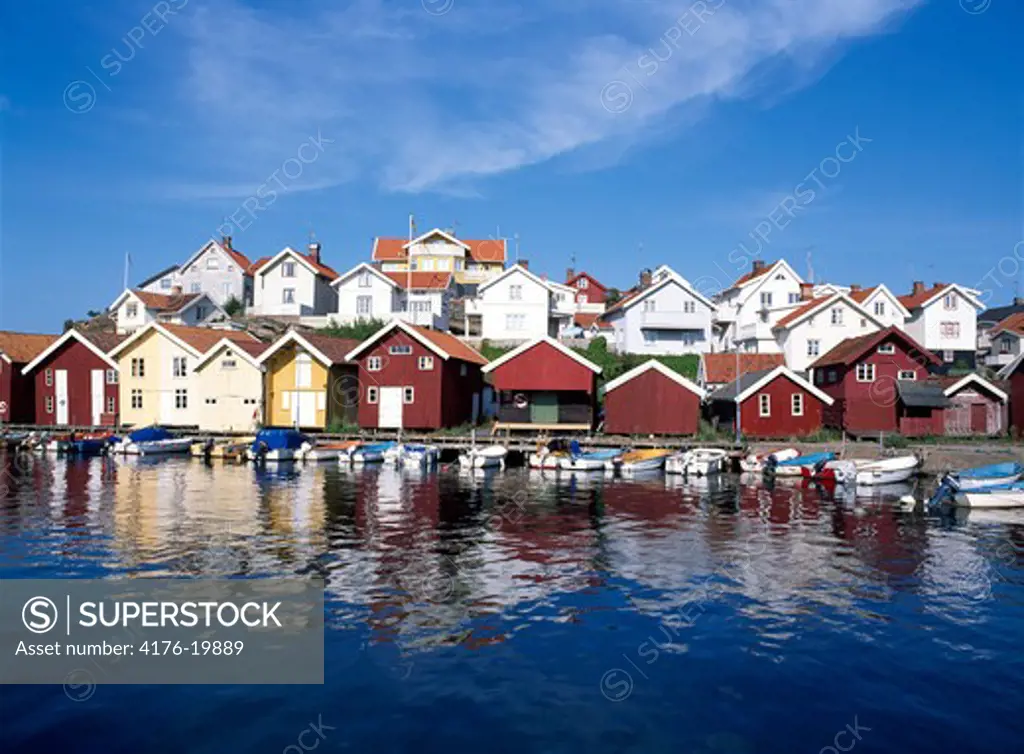 Norway, Boats moored at a river by the houses