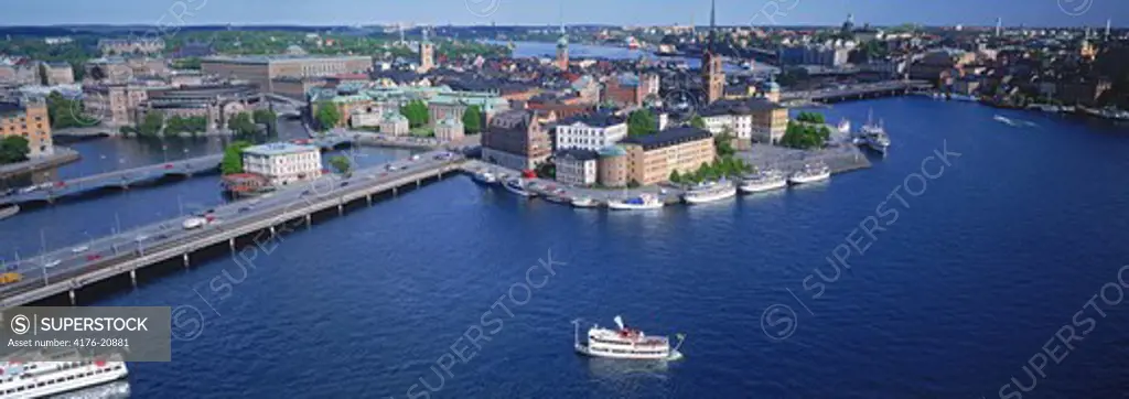Overview from City Hall of Riddarholmen Island with ferryboat on Riddarfjarden waters in Stockholm