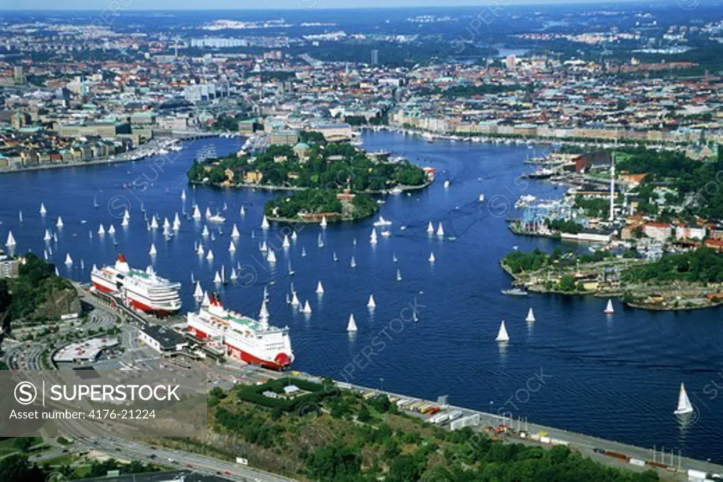 Aerial view of Stockholm with sailboats on Saltsjon and Viking Line passenger ships at Masthamnen docks