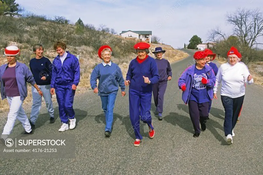 Senior ladies power walking on road in Arizona   USA