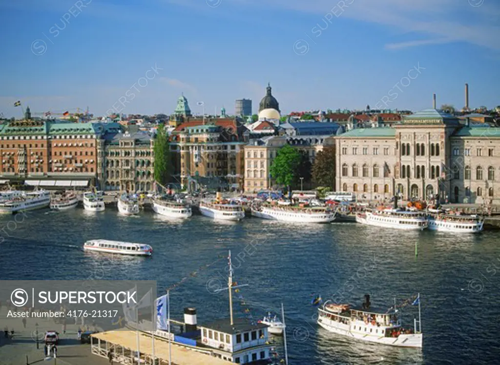 Annual Stockholm Archipelago Boat Day in June with ferryboats anchored at Blasieholmen Island in front of Grand Hotel