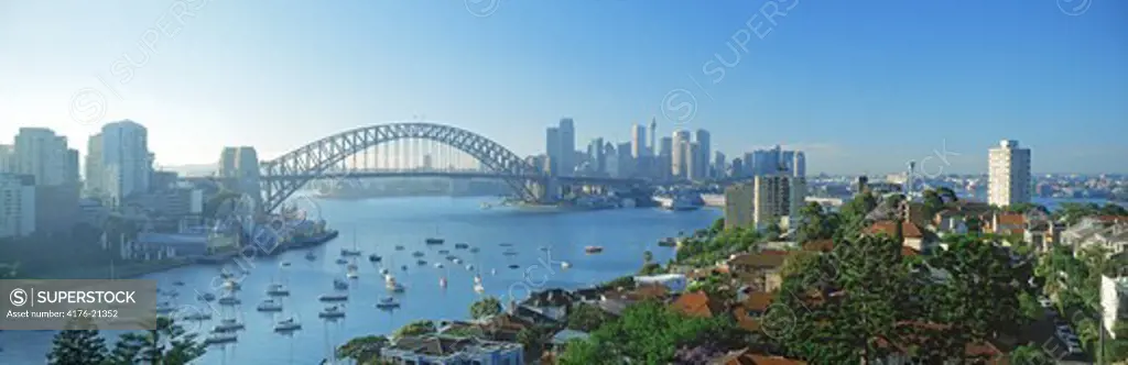Sydney skyline with Harbour Bridge and yachts anchored in Lavender Bay