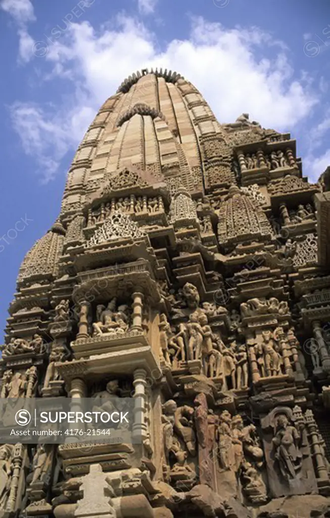 Low angle view of carvings on a temple, Khajuraho, Madhya Pradesh, India
