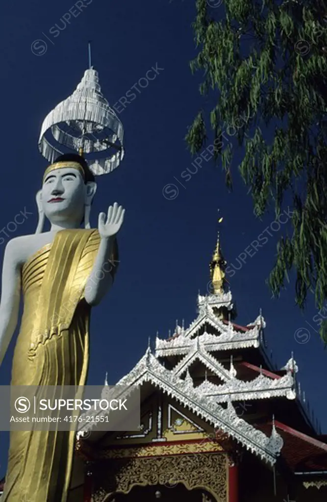 Low angle view of a temple with golden buddha statue