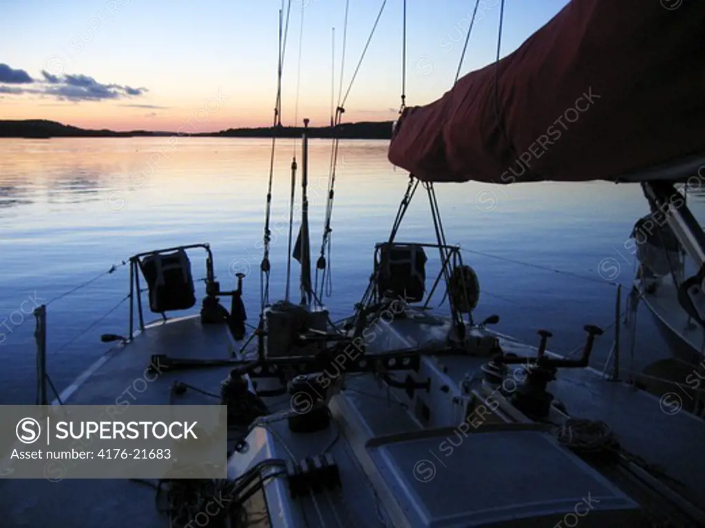 A boat in an archipelago at dusk, Sweden