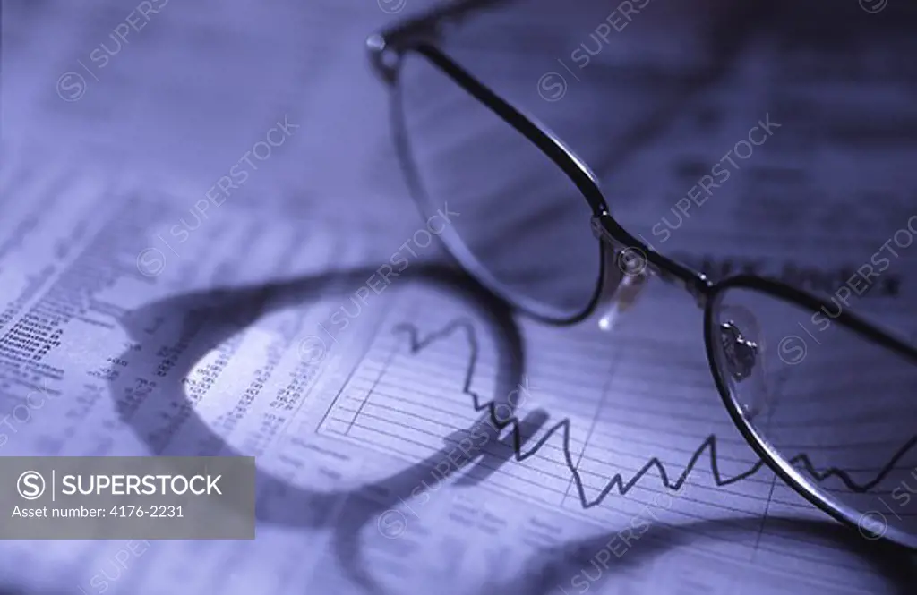 Glasses lying upon some papers