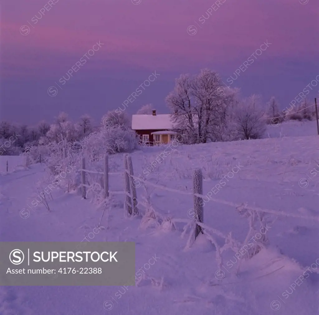 Old farm in cold winter evning, Billingen in Vastergotland (Vastergotland), Sweden.