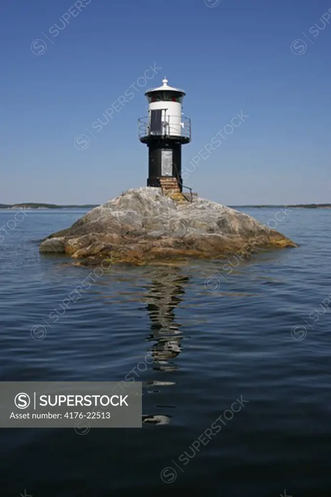 Lighthouse on a small rocky island in Stockholm, Sweden