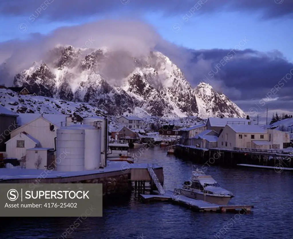 Sweden - Factory on sea with snow covered mountain