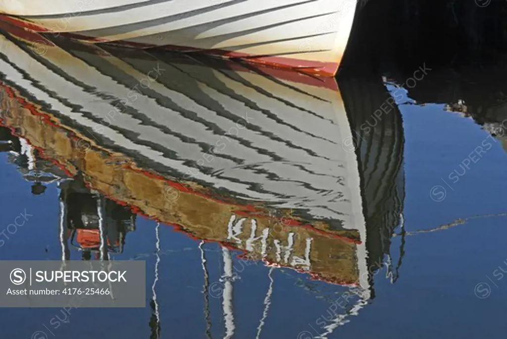Reflection of a boat in water