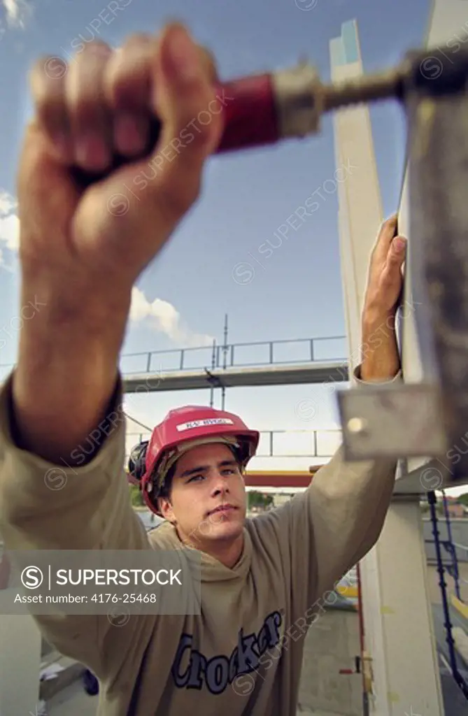 A construction worker building a house in Kalmar, Sweden.