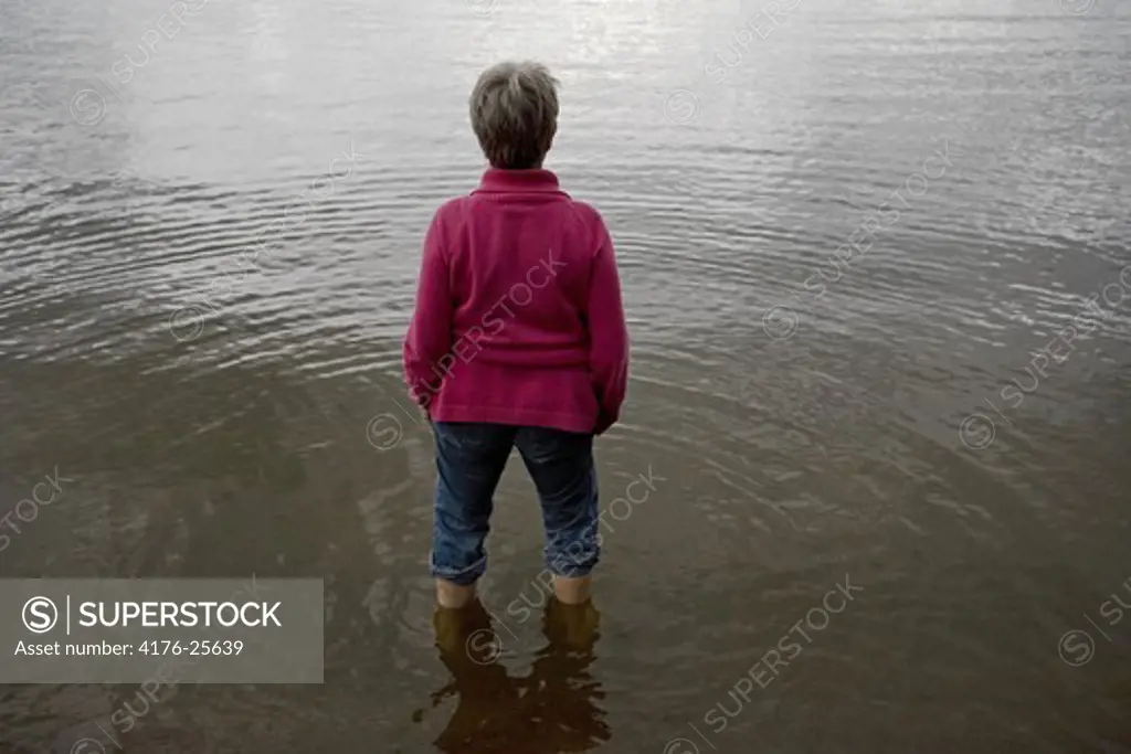 A women standing in lake Vanern (Vanern), Kristinehamn, Sweden