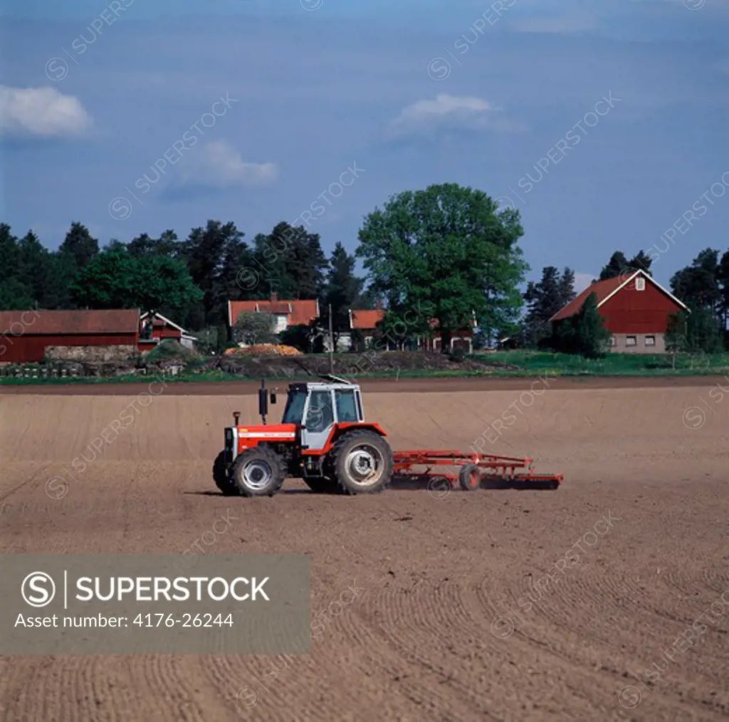 Sweden - Tractor ploughing a field