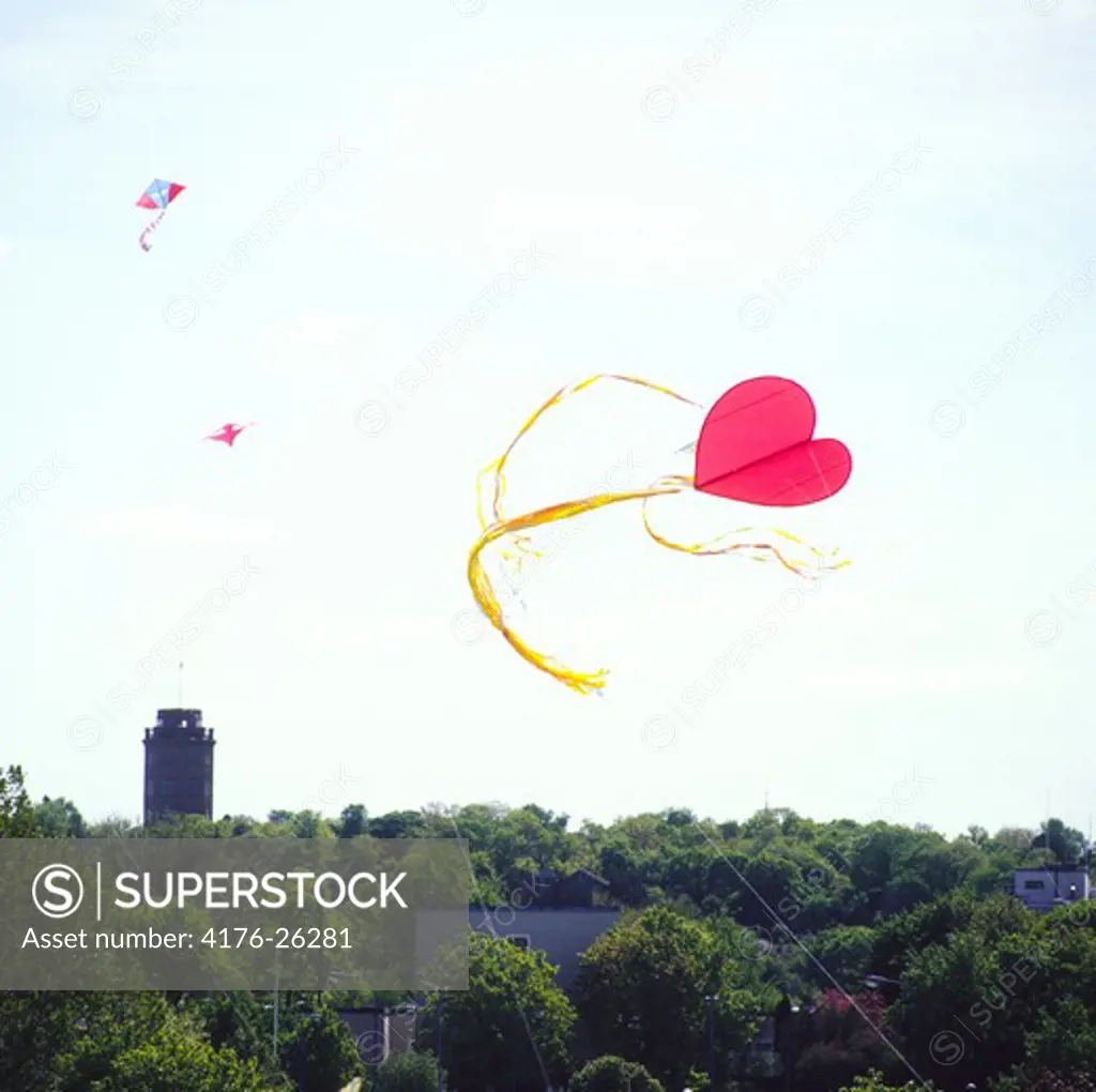Heart shaped kites flying in the sky
