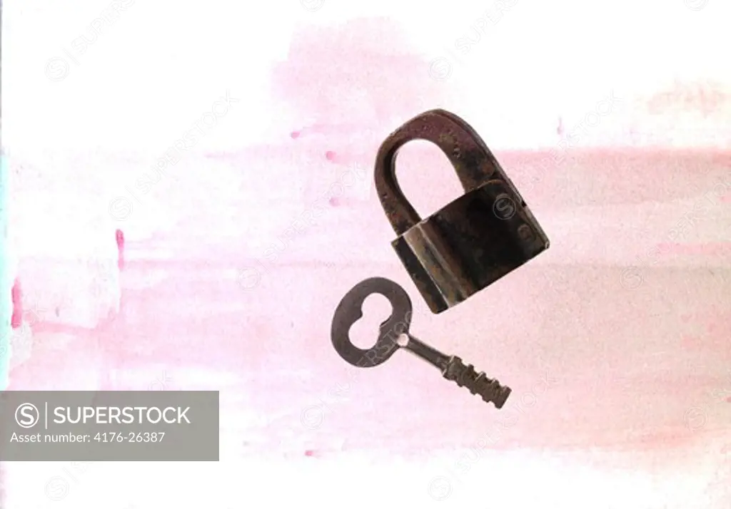 Close-up of a key with a padlock