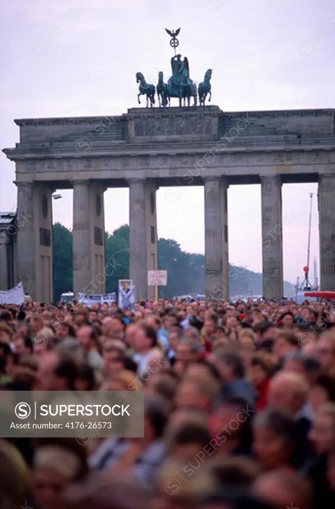 Germany, Berlin - People at a demonstration in front of a city gate, Quadriga Statue, Brandenburg Gate