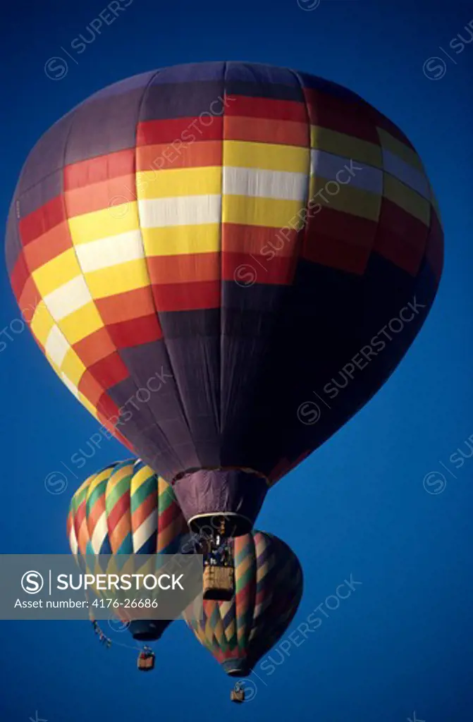 Low angle view of hot air balloons floating in the sky