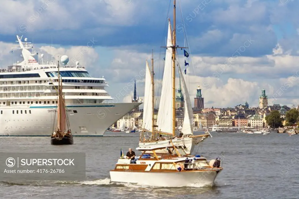 Sweden, Stockholm - Sailboats and a ferry in the sea - Tall Ship Race 2011