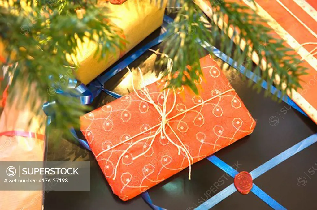 High angle view of Christmas presents under a Christmas tree