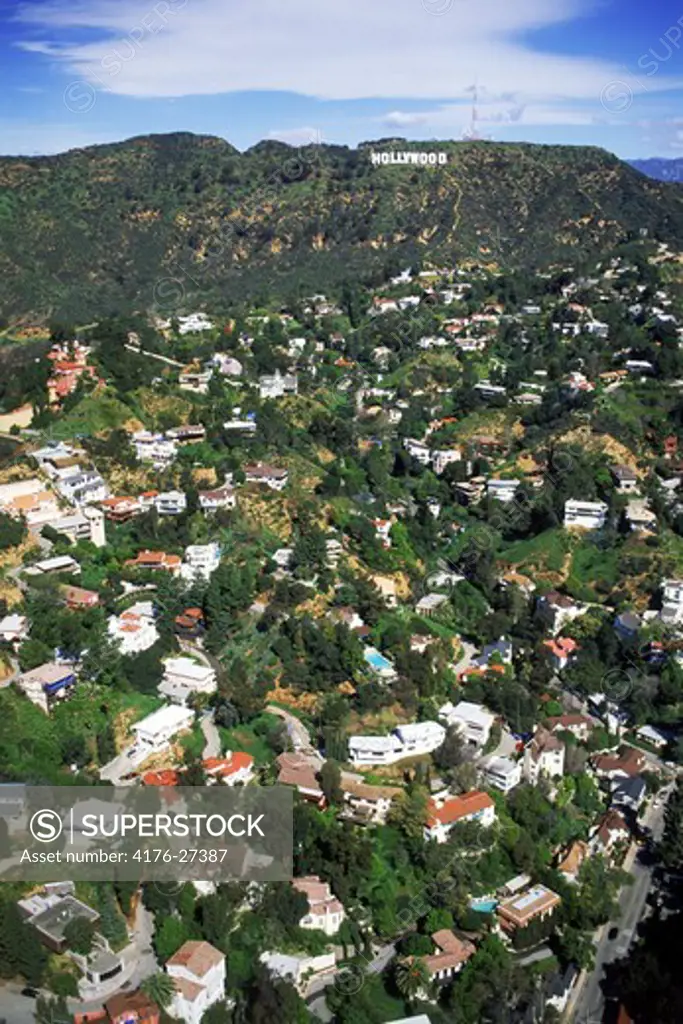 Aerial view of exclusive hillside homes below Hollywood sign in Hollywood Hills, California