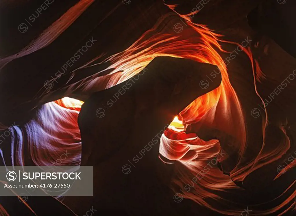 Light seeping through sandstone rock formations in Antelope Canyon near Page, Arizona