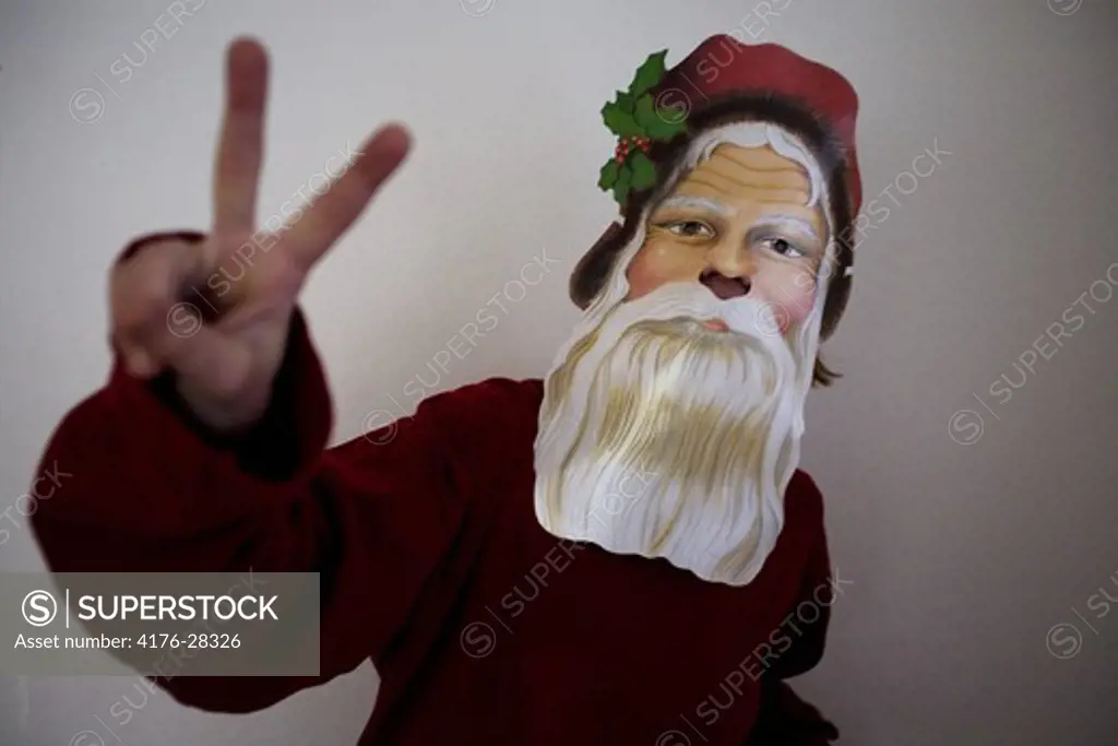 A Santa Claus makes the victory sign, Kalmar, Sweden.