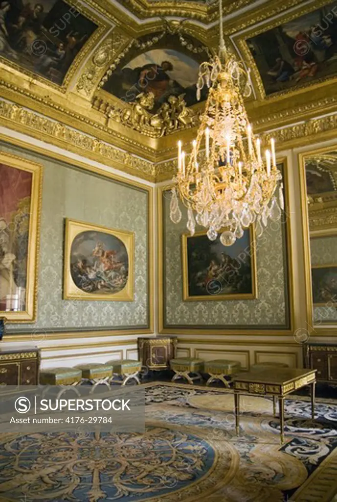 An interior all in gold in the castle of Versailles. France