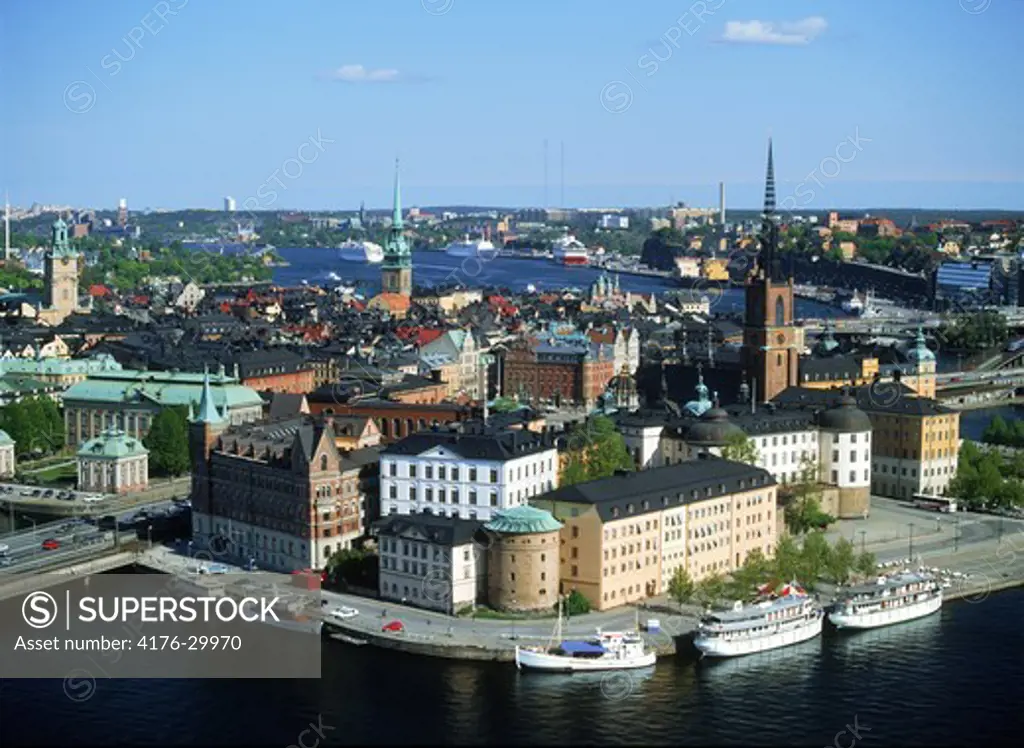 Overview of Riddarholmen Island with yachts and Gota Canal boats from the City Hall Tower in Stockholm