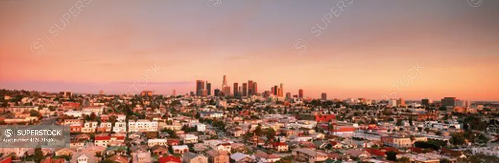Downtown Los Angeles skyline over East Los Angeles suburbs at sunset