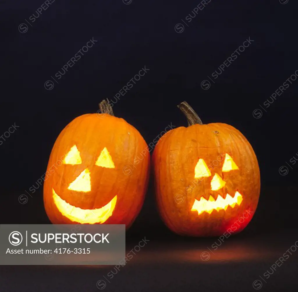 Two burning Halloween pumpkins