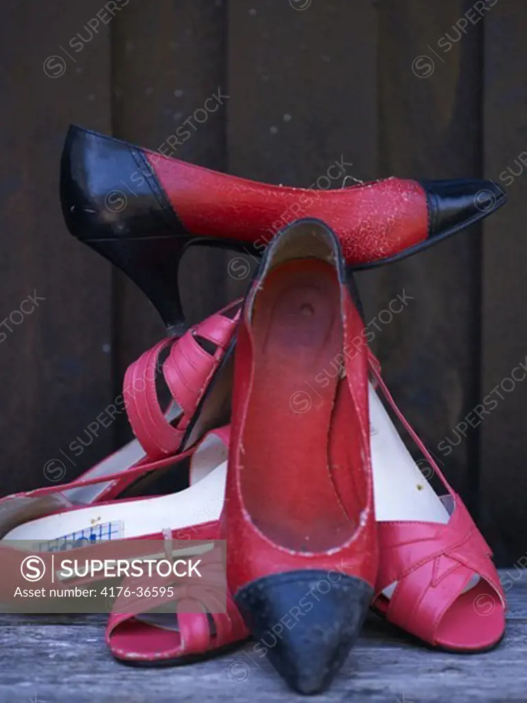 A pile of red shoes