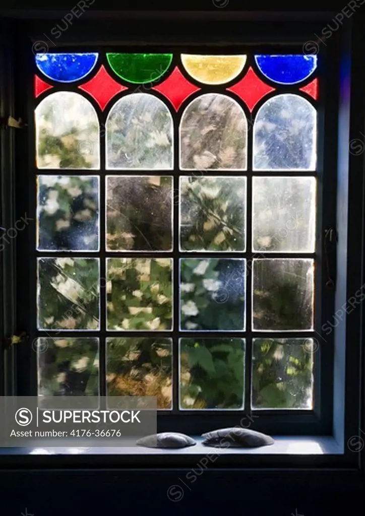 An old window with colored glass