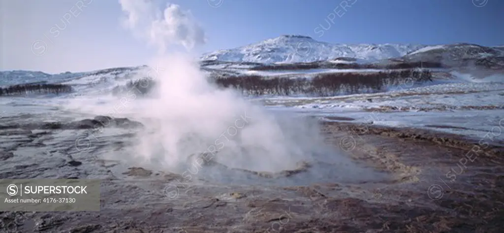 Iceland, Haukadalur - Steam emerging from a natural geyser