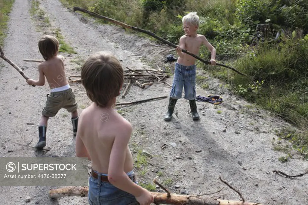 Boys playing with sticks, Sweden
