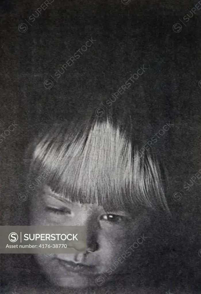 A boy taking his selfportrait on a copymachine.