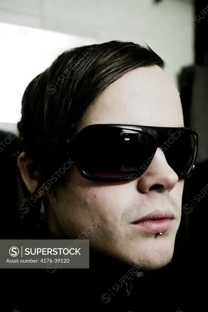 Portrait of a young man with sunglasses, Sweden.