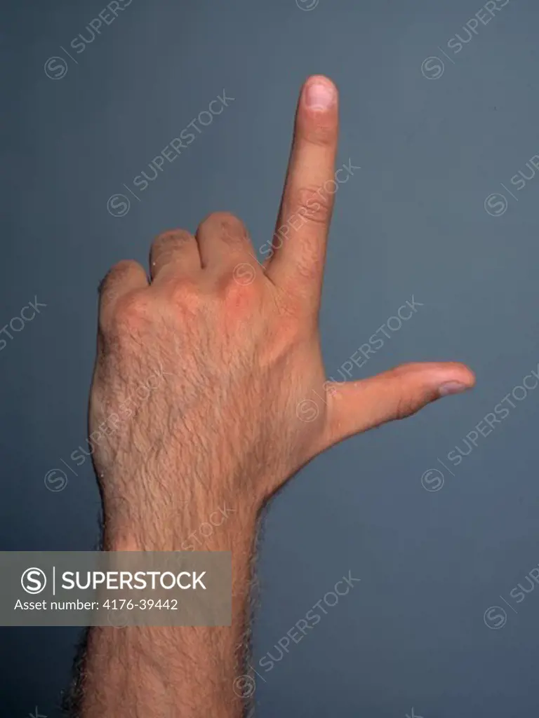Close-up hand pointing upward