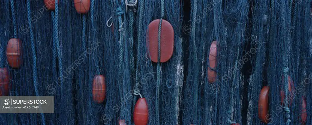 Close-up of floats of a hanging fishing net